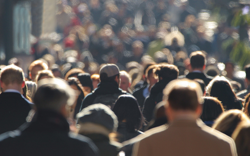 Picture of a crowd of people walking street