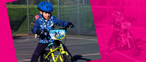 A photograph of a child learning to ride a bike